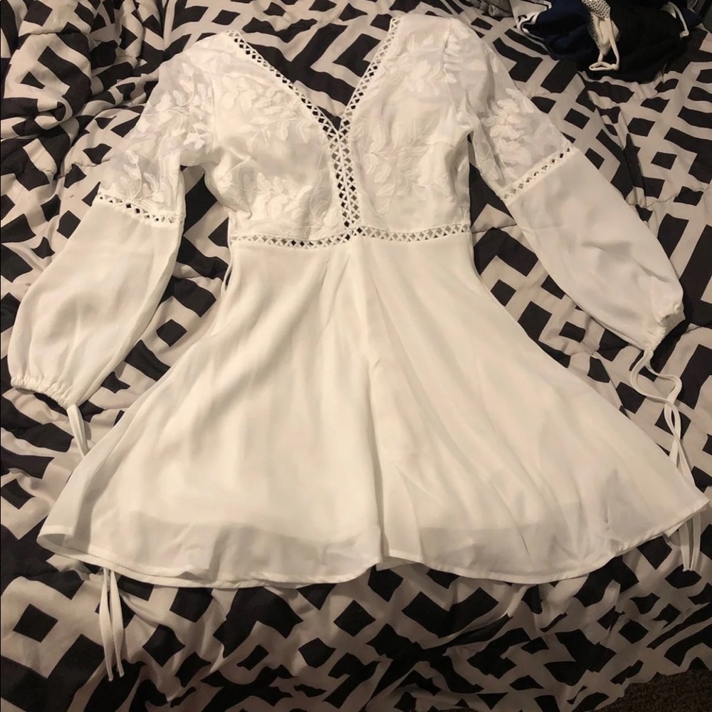 White, low-back, embroidered dress